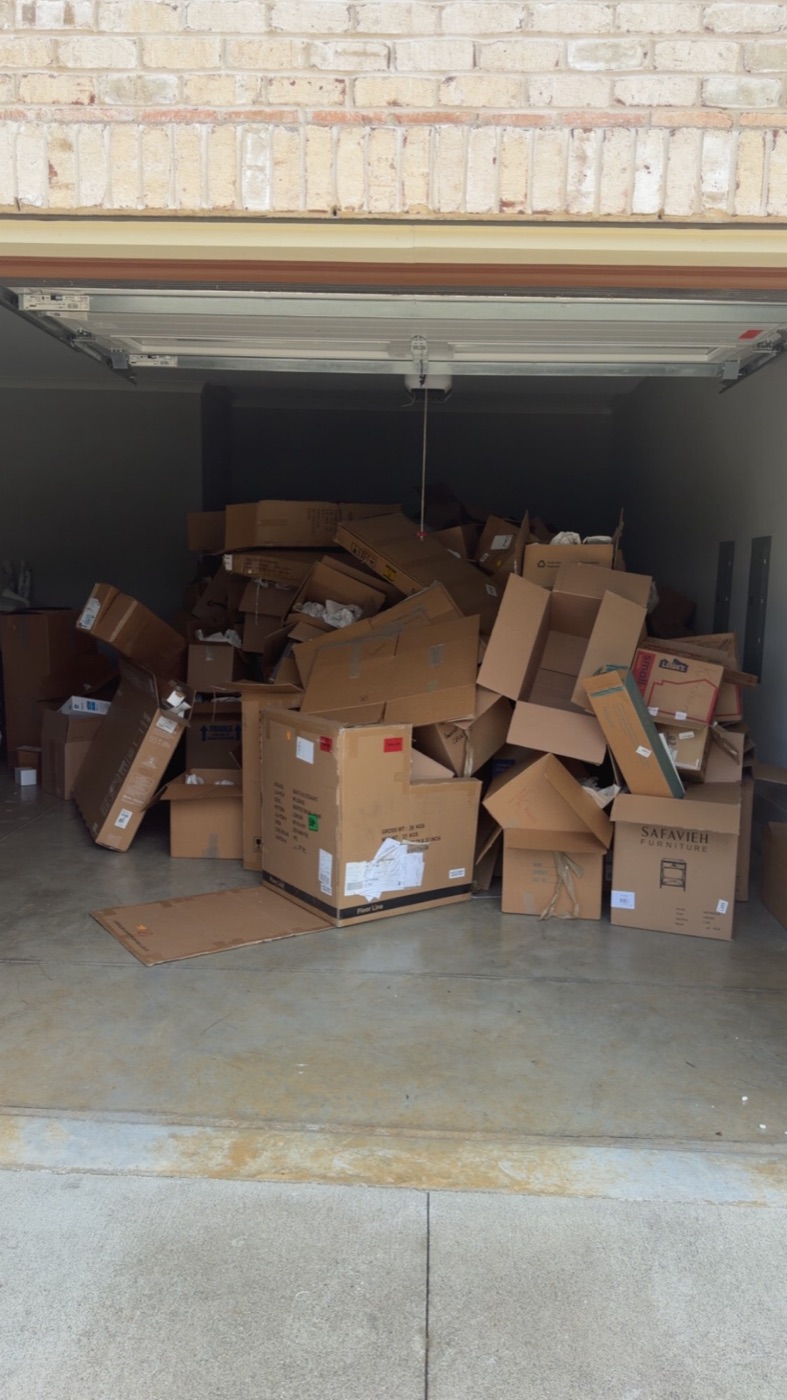 Before: a garage packed wall to wall with moving boxes